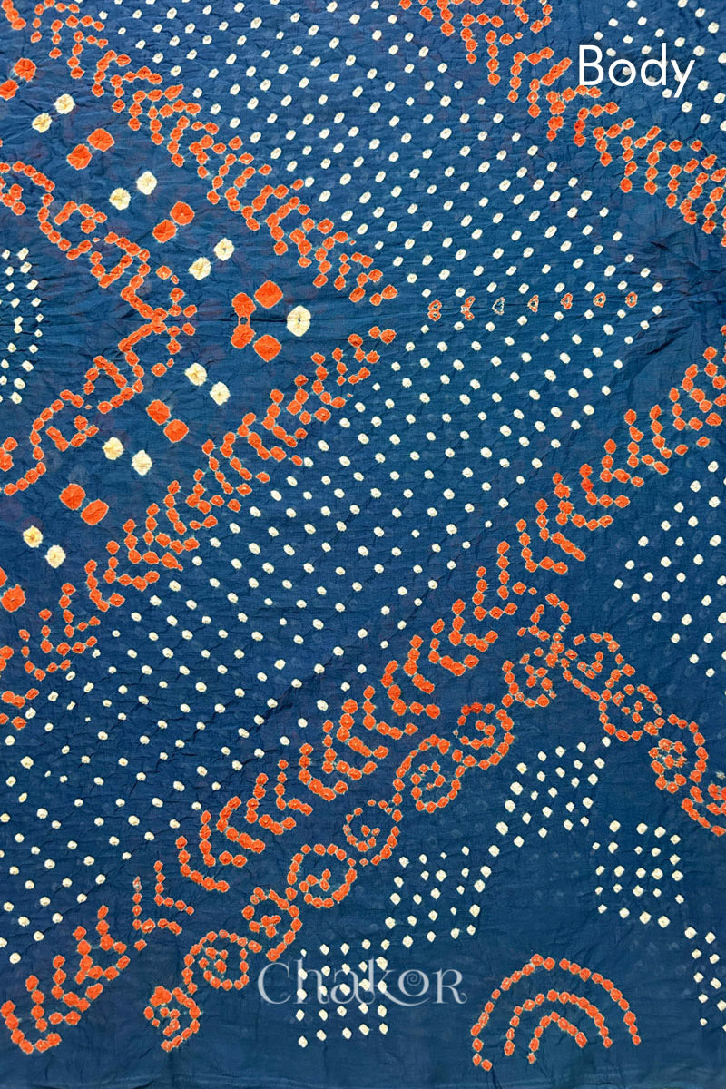 Body Detail: Handmade Bandhani Cotton Saree with Soft Orange and White Dots in Earthy Indgio Blue by Chakor.