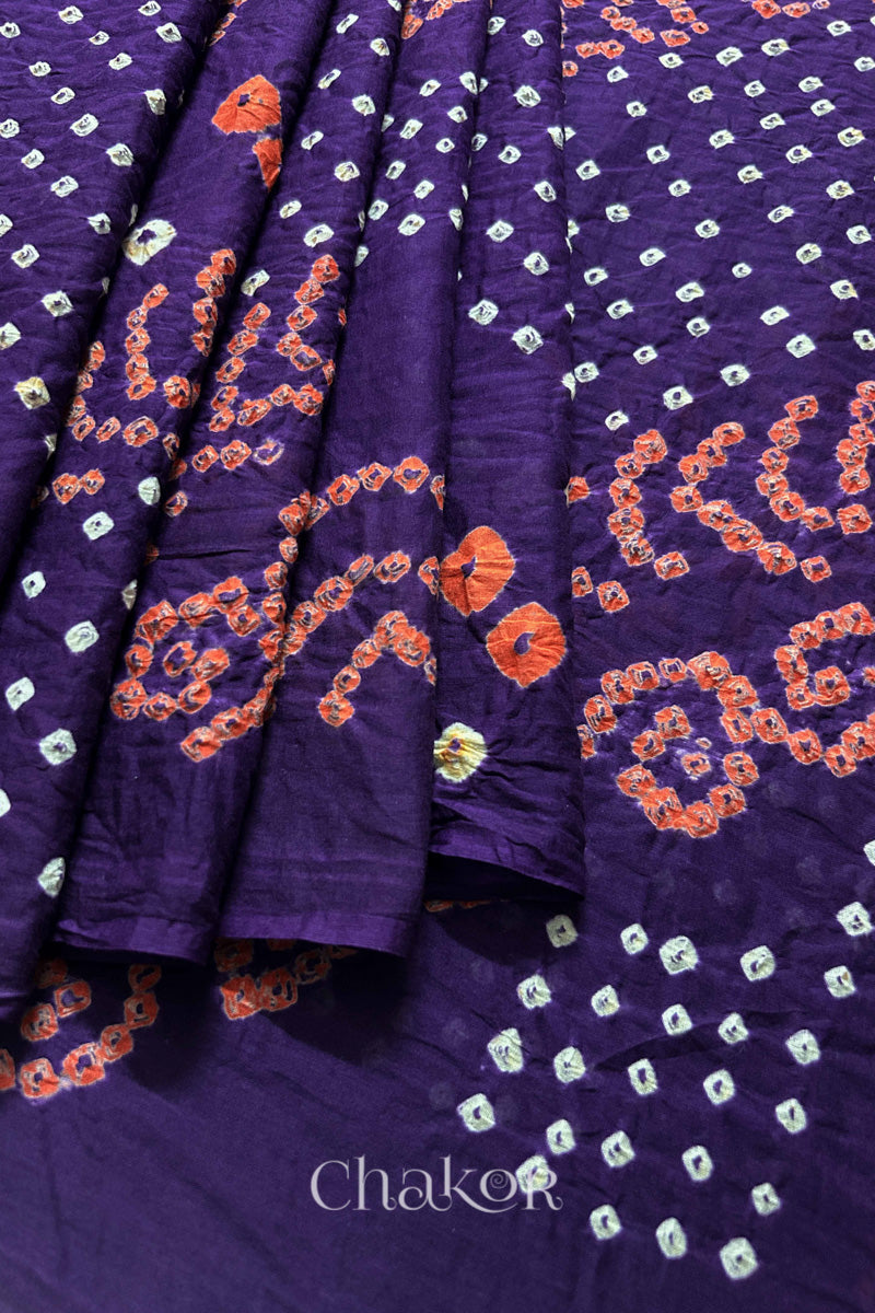 Close up of Tridev Mulmul Cotton purple saree with handcrafted Bandhani  – The Chakor Shop.