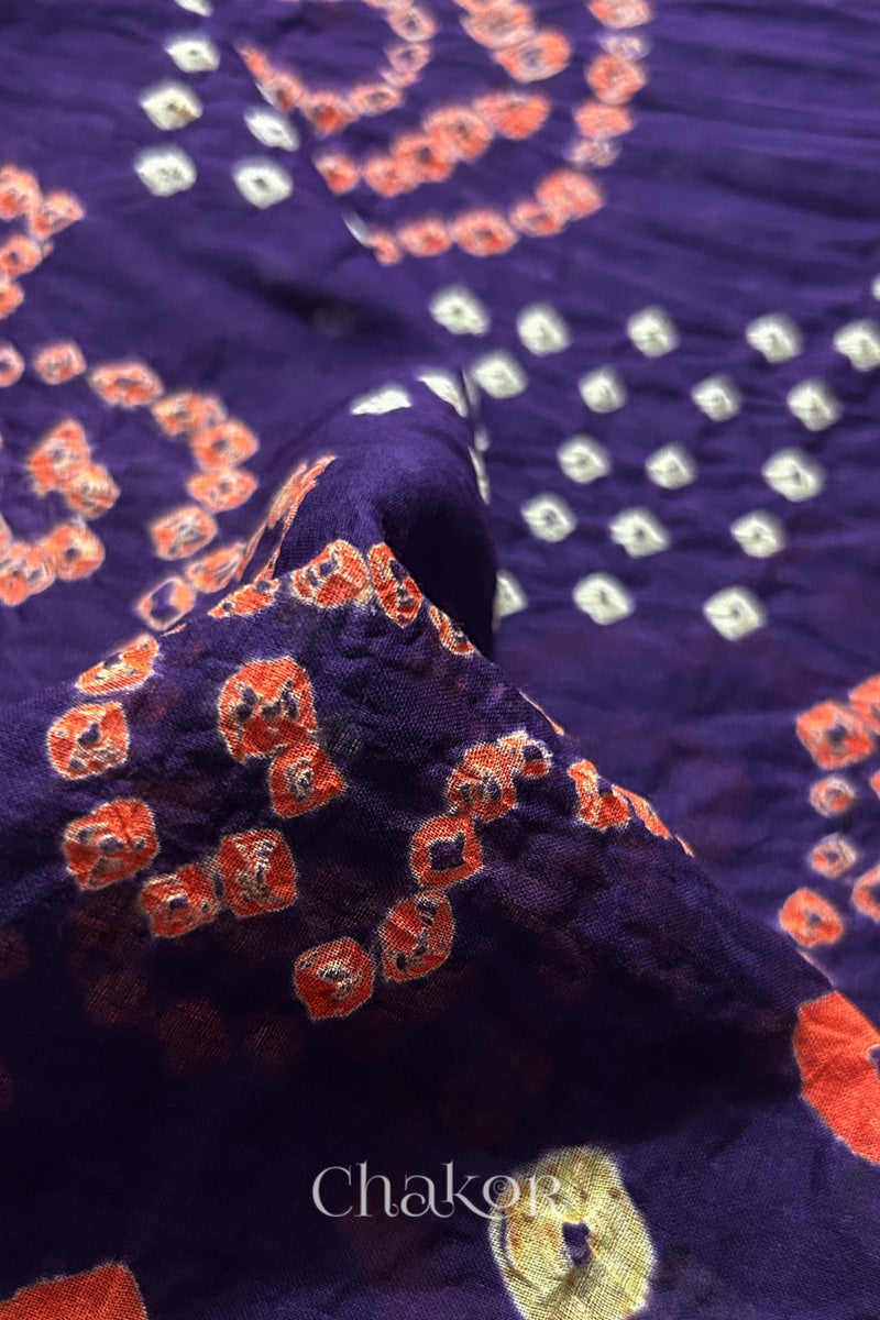 Close up of Tridev Mulmul Cotton purple saree with handcrafted Bandhani  – The Chakor Shop.