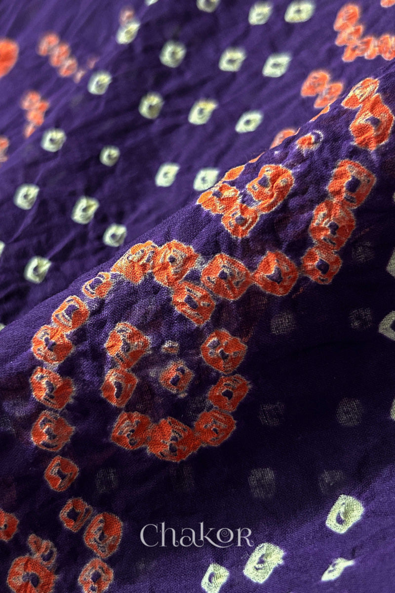 Close up of Tridev Mulmul Cotton purple saree with handcrafted Bandhani  – The Chakor Shop.