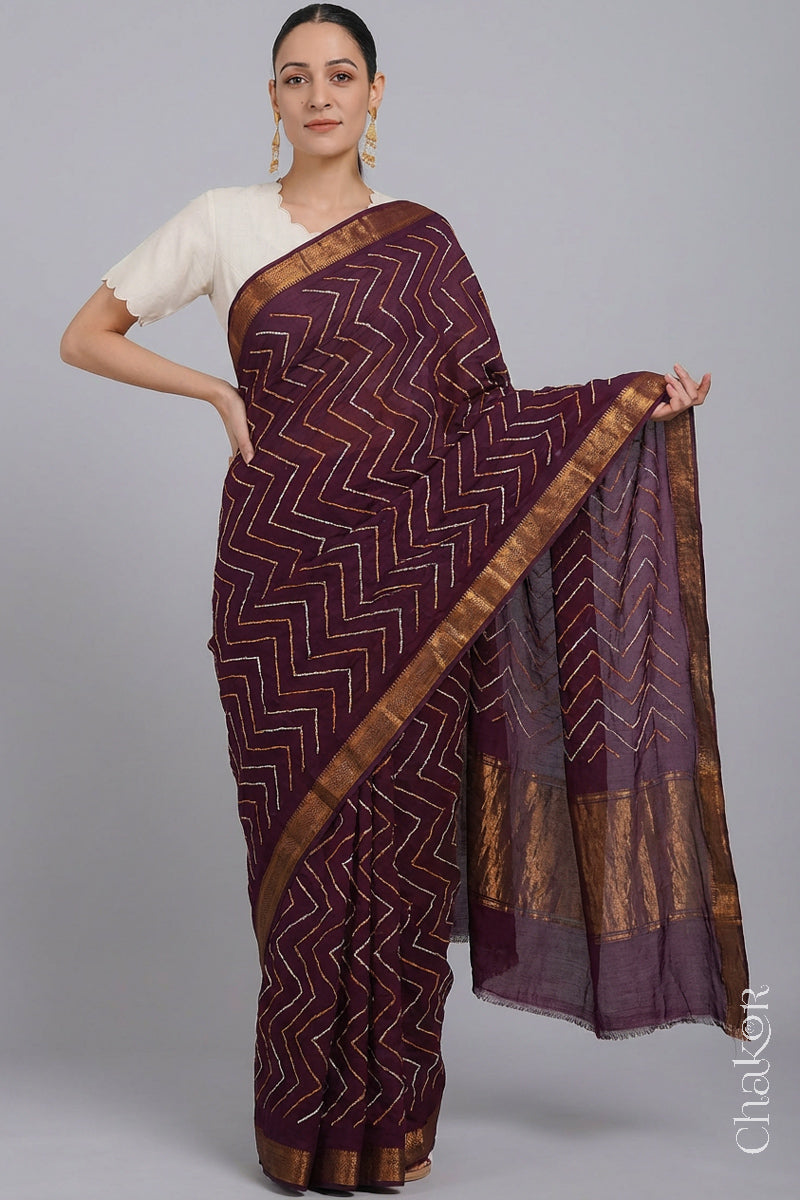 Woman wearing Red Bandhani Mangalagiri Handloom Cotton Saree, with handcrafted rai bandhej patterns using traditional tie-dye techniques.