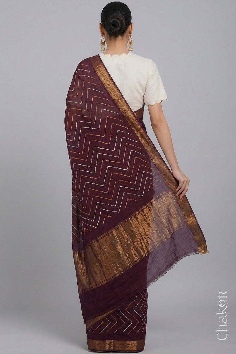 Woman wearing Maroon Bandhani Mangalagiri Handloom Cotton Saree, with handcrafted rai bandhej patterns using traditional tie-dye techniques.