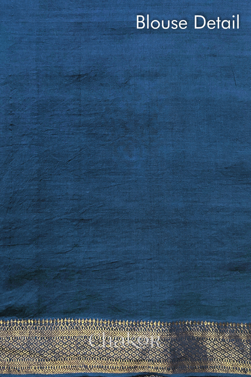 Blouse detail of indigo blue bandhani saree with woven golden zari border. Watermark text reads 'Chakor'.