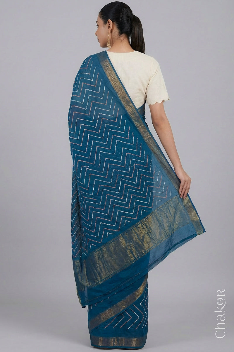 Woman wearing Indigo Blue Bandhani Mangalagiri Handloom Cotton Saree, with handcrafted rai bandhej patterns using traditional tie-dye techniques.