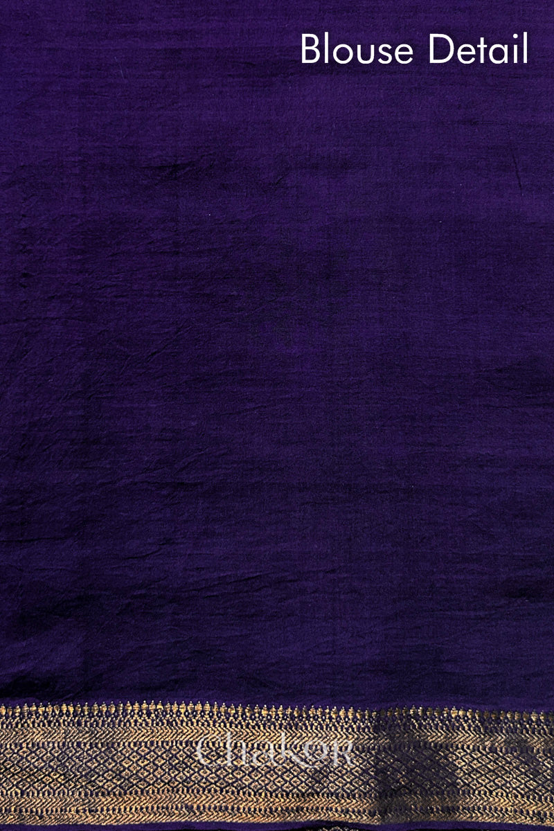 Blouse detail of Purple bandhani saree with woven golden zari border.
