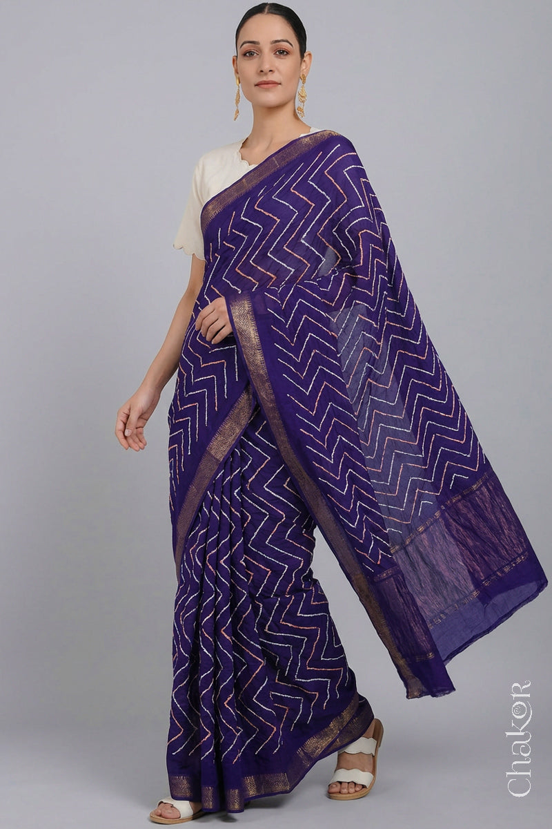 Woman wearing Purple Bandhani Mangalagiri Handloom Cotton Saree, with handcrafted rai bandhej patterns using traditional tie-dye techniques.