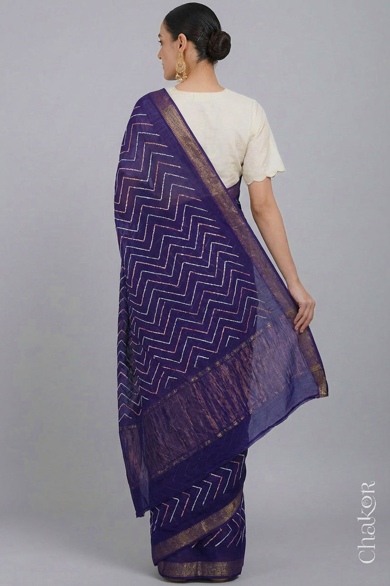 Woman wearing Purple Bandhani Mangalagiri Handloom Cotton Saree, with handcrafted rai bandhej patterns using traditional tie-dye techniques.