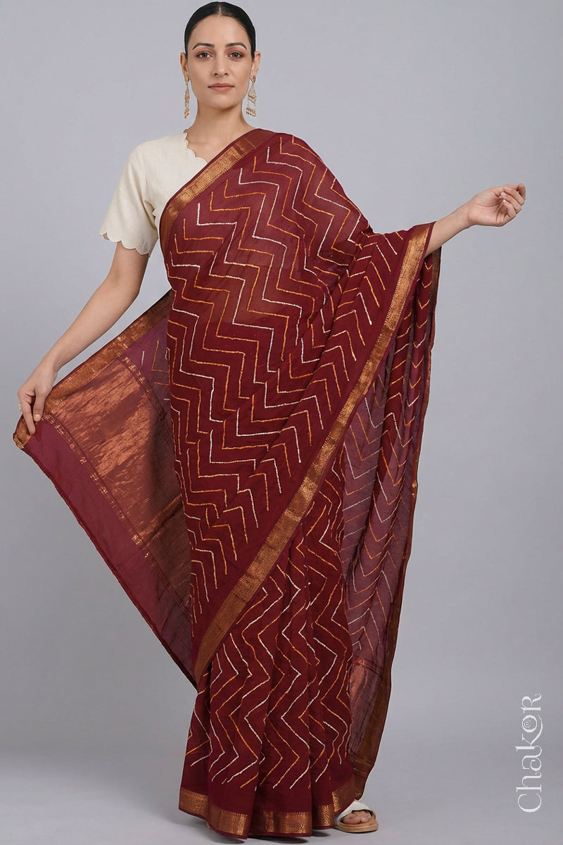 Woman wearing Red Bandhani Mangalagiri Handloom Cotton Saree, with handcrafted rai bandhej patterns using traditional tie-dye techniques.