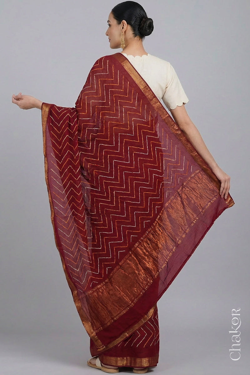 Woman wearing Red Bandhani Mangalagiri Handloom Cotton Saree, with handcrafted rai bandhej patterns using traditional tie-dye techniques.