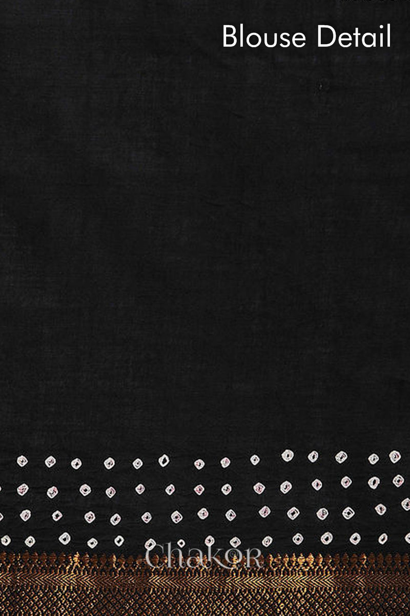 Blouse detail of black bandhani saree with white tie-dye dots & woven golden zari border.
