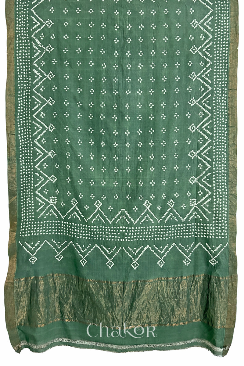 moss green saree, flat draped with Rai Bandhej traditional design against white background and 'Chakor' watermark.
