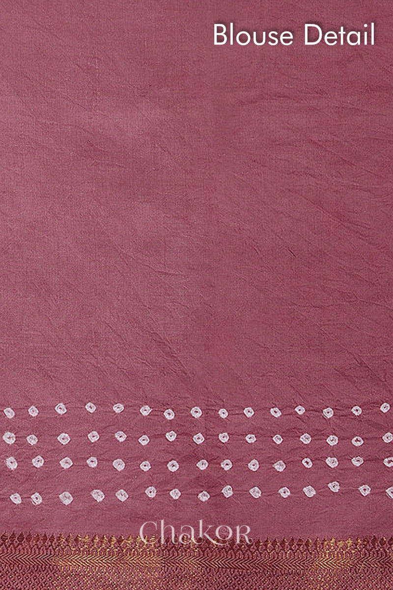 Blouse detail of old rose bandhani saree with white tie-dye dots & woven golden zari border.
