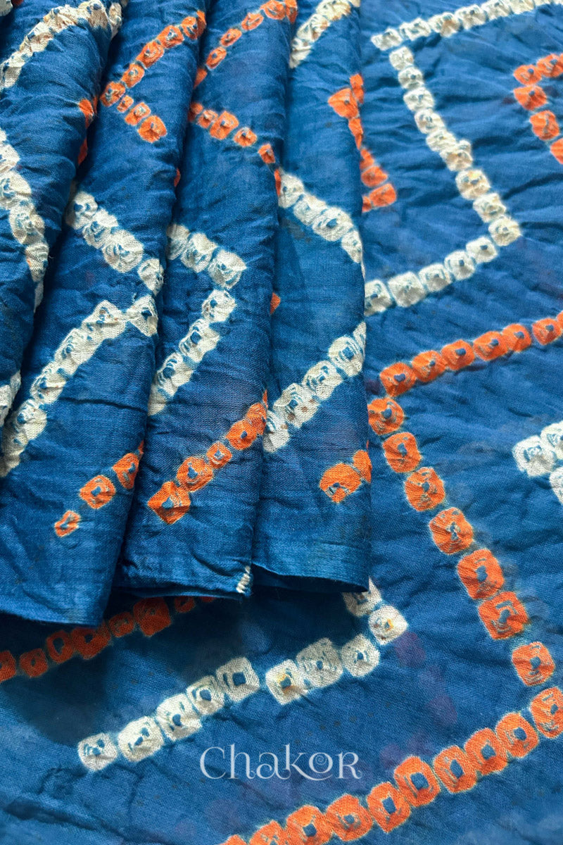 Pleats and pallu view of Indigo Blue Bandhani Mul Cotton Saree with zigzag patterns in yellow and white bandhej dots.