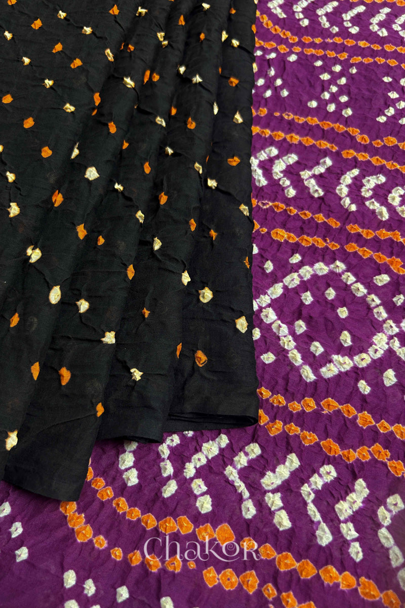 Pleats and pallu view of Black and Magenta Bandhani Mul Cotton Saree featuring multicoloured bandhej patterns.