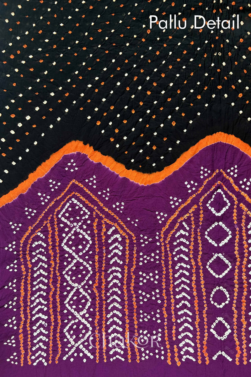 Pallu detail of Black and Magenta Bandhani Mul Cotton Saree featuring multicoloured bandhej patterns.
