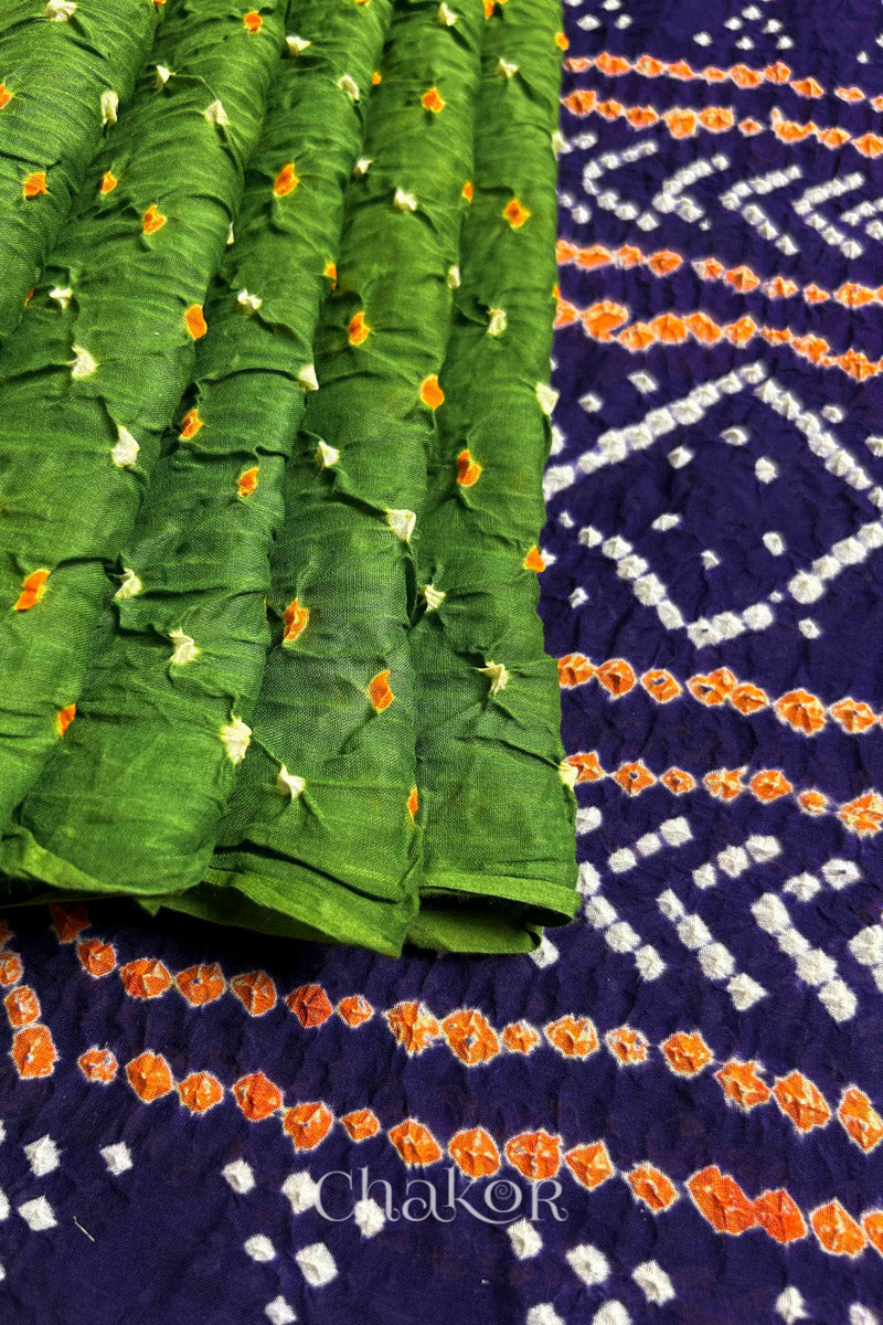 Pleats and pallu view of Mehendi Green and Purple Bandhani Mul Cotton Saree featuring multicoloured bandhani patterns.