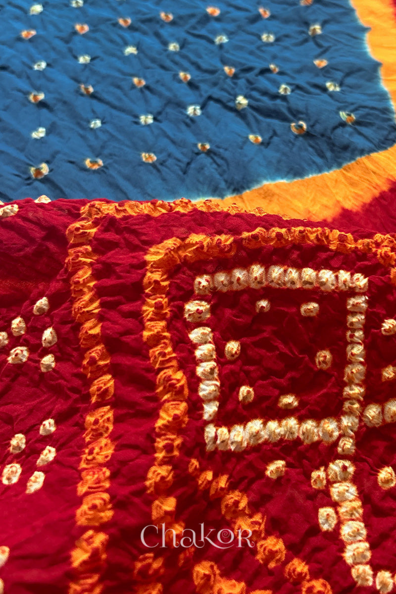 Close up of Indigo and Red Bandhani Mul Cotton Saree featuring multicoloured bandhani patterns.