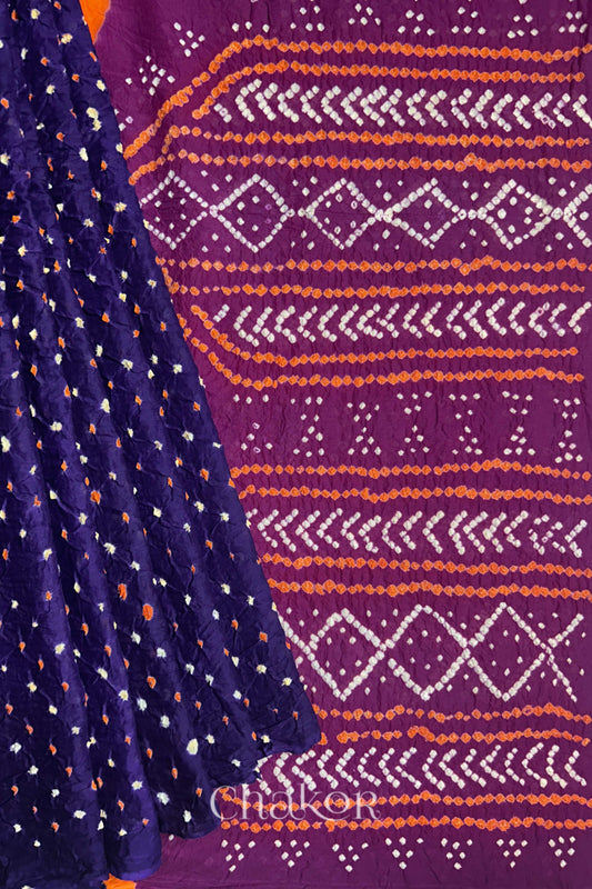 Purple pleats and Magenta Pallu of Bandhani Mul Cotton Saree featuring multicoloured bandhani patterns.