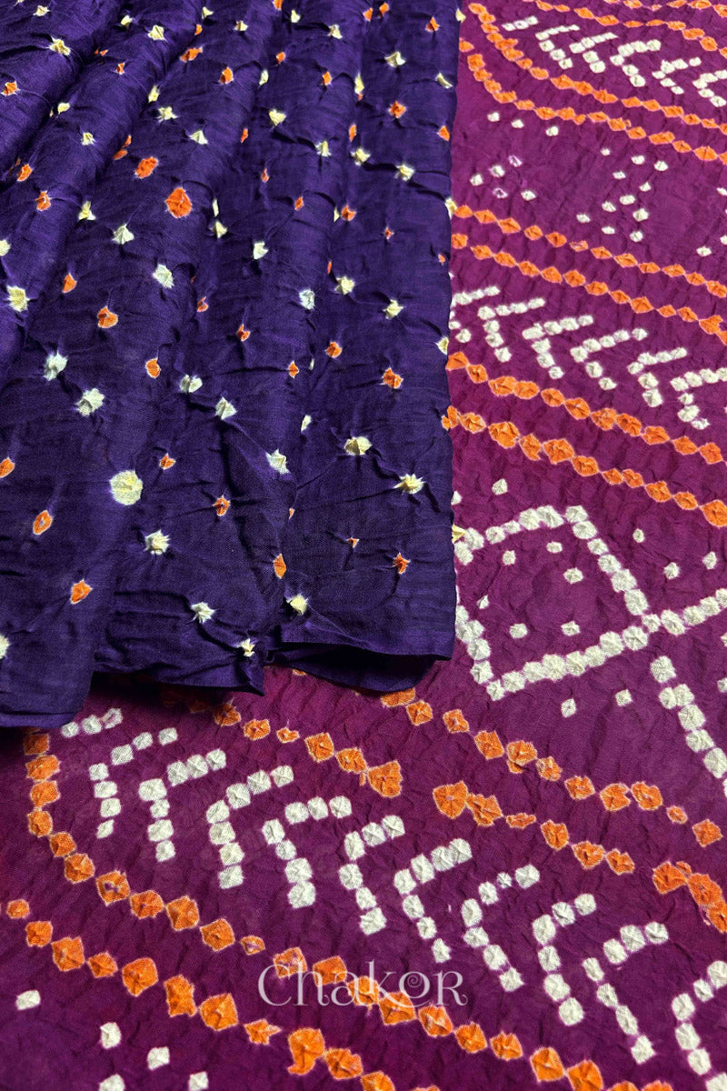 Purple pleats and Magenta Pallu of Bandhani Mul Cotton Saree featuring multicoloured bandhani patterns.