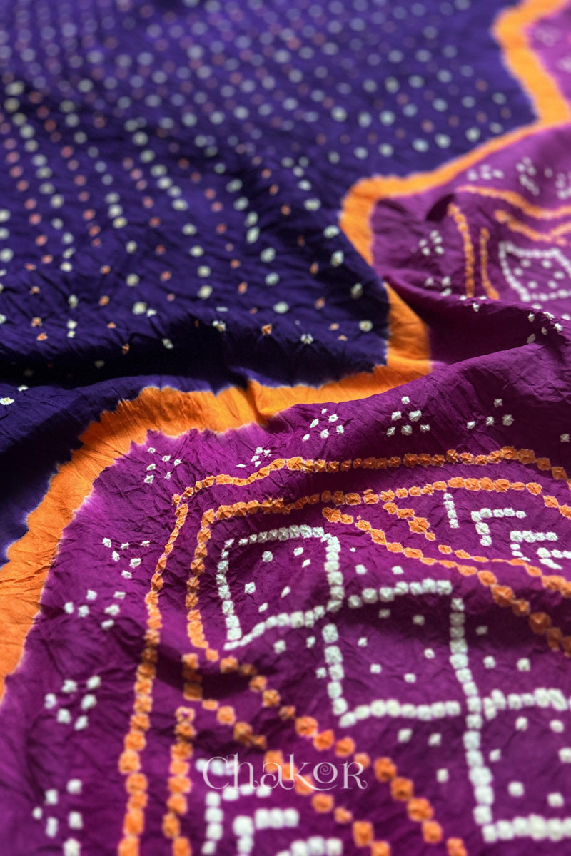 Close up of Purple and Magenta Bandhani Mul Cotton Saree featuring multicoloured bandhani patterns.