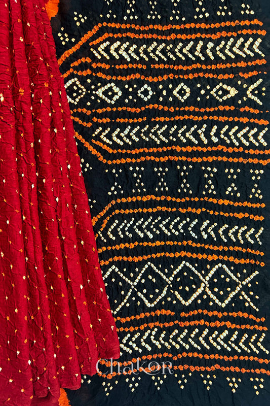 Red pleats and black pallu view of Red Black Bandhani Mul Cotton Saree featuring multicouloured bandhani patterns.