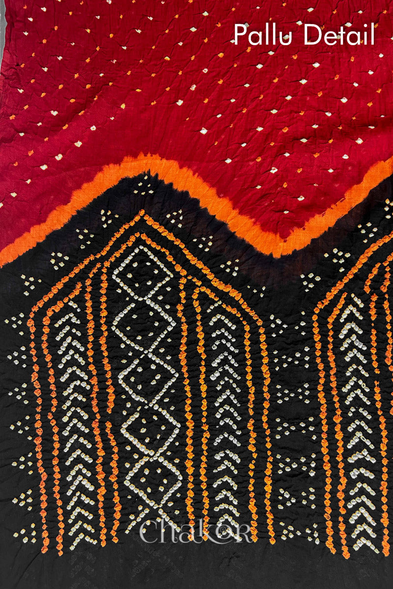 Pallu detail of Red Black Bandhani Mul Cotton Saree featuring multicouloured bandhani patterns.