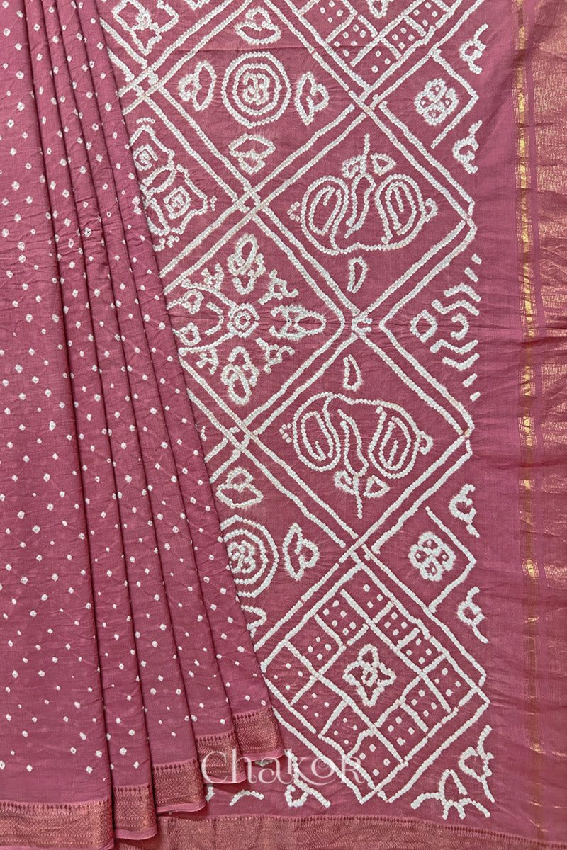 Old rose saree, neatly arranged in pleats with Rai Bandhej traditional design and 'Chakor' brand watermark.
