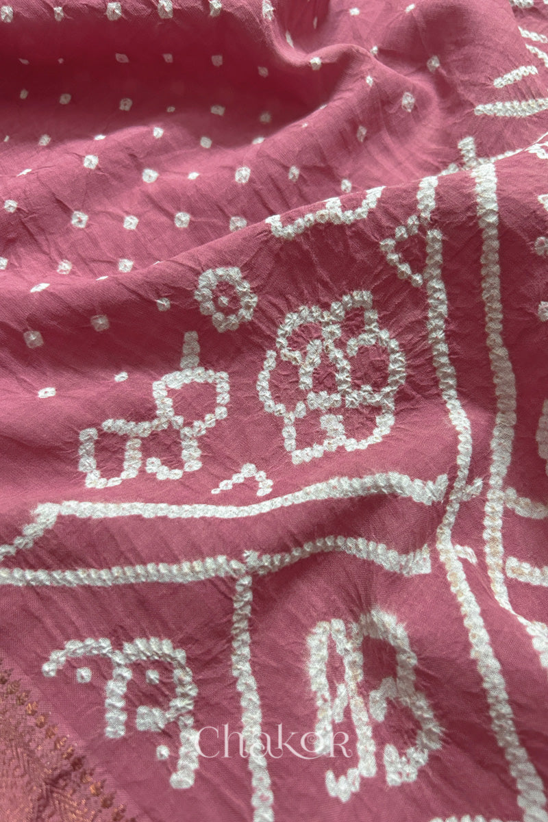 Close-up of Old rose sarees featuring rai bandhani showcasing beautiful craftsmanship.
