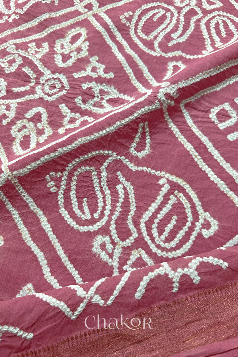 Close-up of Old rose sarees featuring rai bandhani and zari weaving showcasing beautiful craftsmanship.
