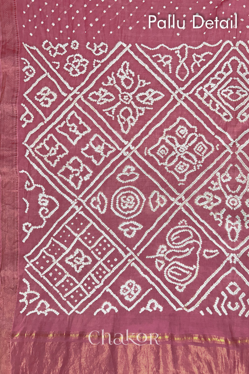 Pallu detail of Old rose bandhani saree with woven golden zari border and pallu.
