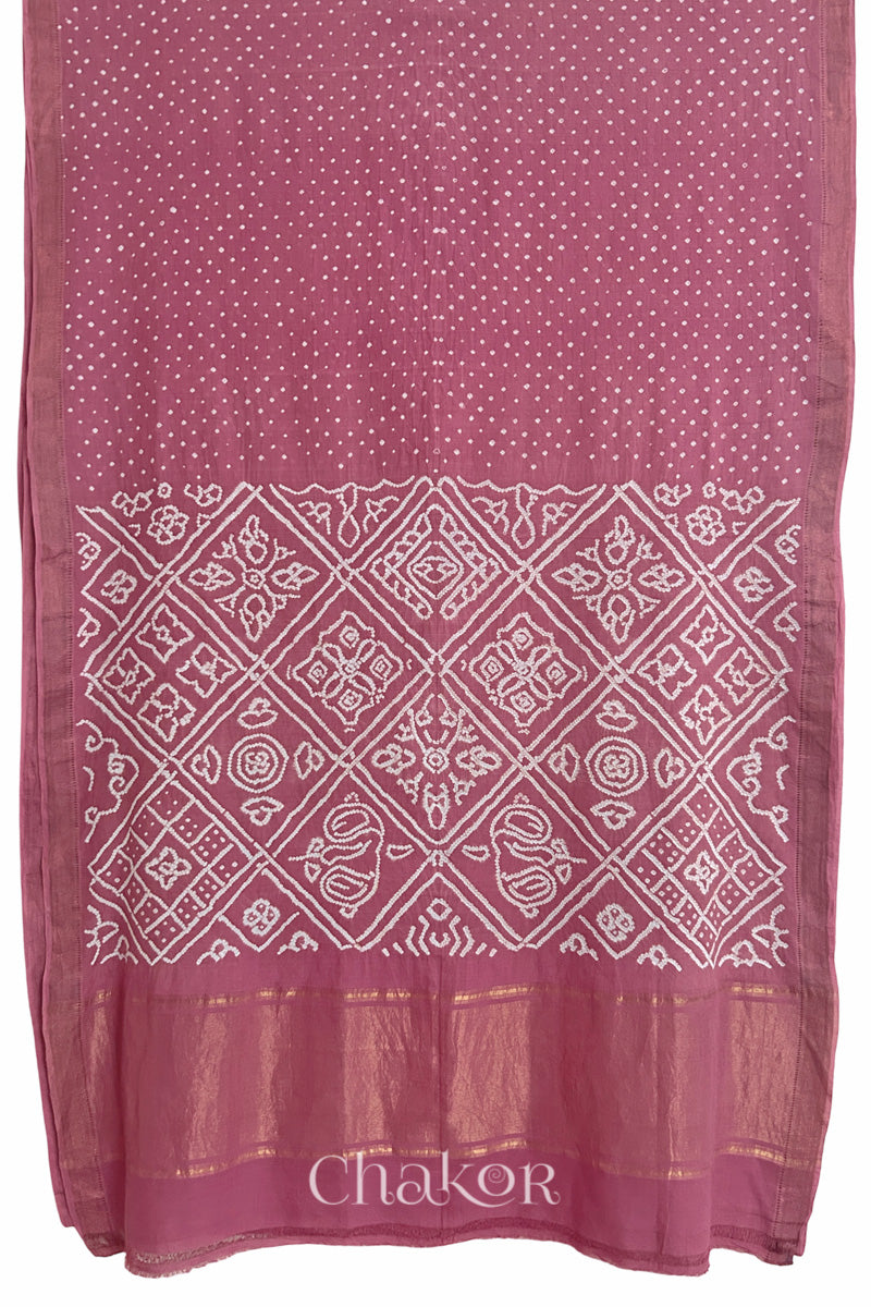Old rose saree, flat draped with Rai Bandhej traditional design against white background and 'Chakor' watermark.
