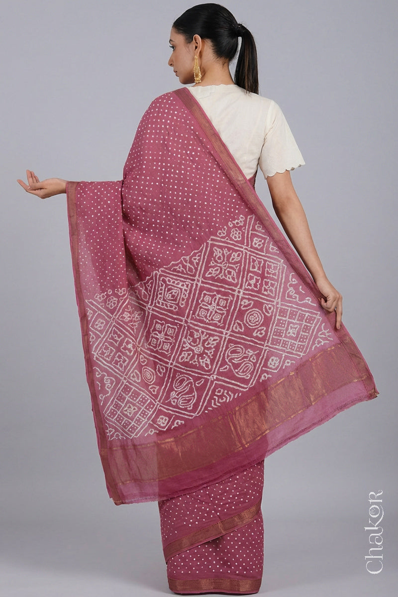 Woman wearing Rose pink Bandhani Mangalagiri Handloom Cotton Saree, with handcrafted rai bandhej patterns using traditional tie-dye techniques.