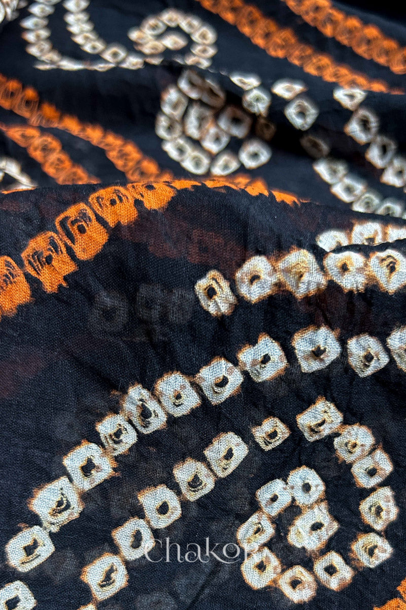 Close up of Indigo and Black Bandhani Mul Cotton Saree featuring multicoloured bandhani patterns.