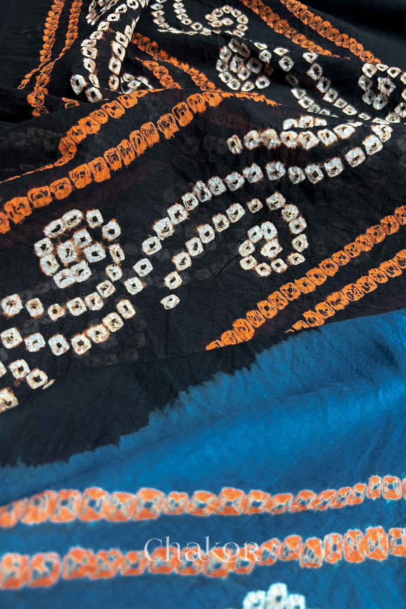 Close up of Indigo and Black Bandhani Mul Cotton Saree featuring multicoloured bandhani patterns.