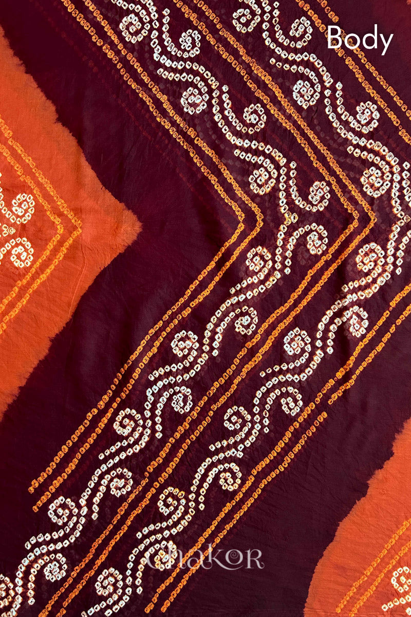 Body detail of Maroon Rust Bandhani Mul Cotton Saree featuring multicoloured bandhani patterns.