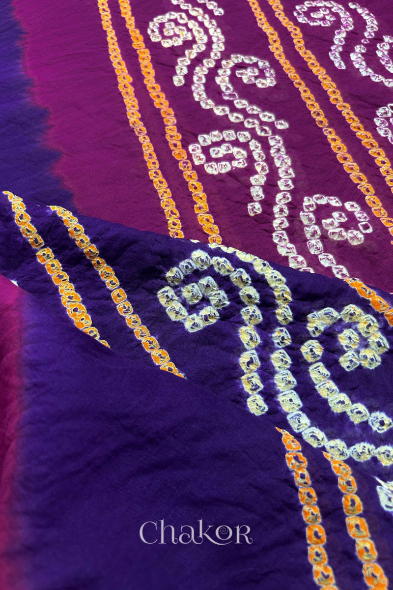 Close up of Purple Magenta Bandhani Mul Cotton Saree featuring multicoloured bandhani patterns.