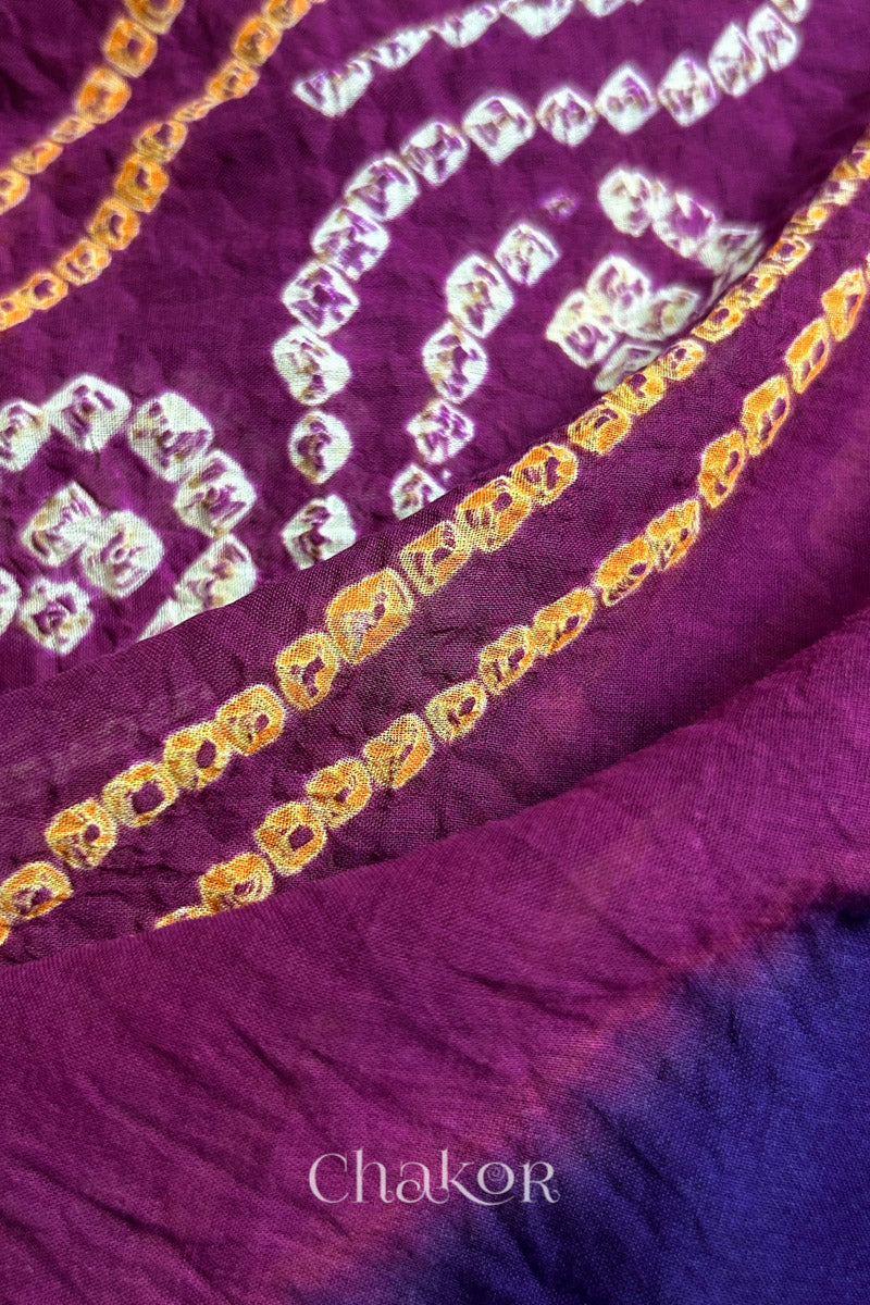 Close up of Purple Magenta Bandhani Mul Cotton Saree featuring multicoloured bandhani patterns.