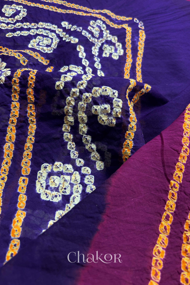 Close up of Purple Magenta Bandhani Mul Cotton Saree featuring multicoloured bandhani patterns.