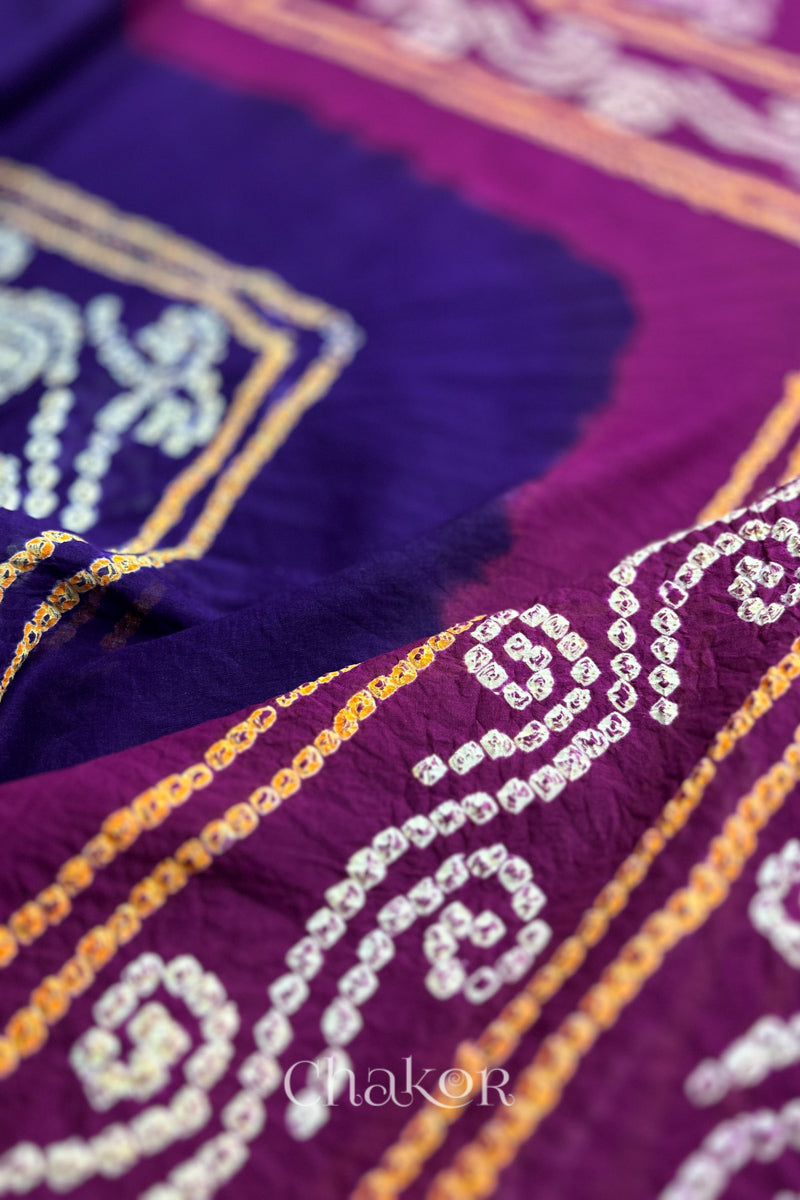 Close up of Purple Magenta Bandhani Mul Cotton Saree featuring multicoloured bandhani patterns.