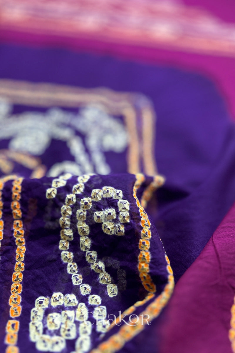 Close up of Purple Magenta Bandhani Mul Cotton Saree featuring multicoloured bandhani patterns.