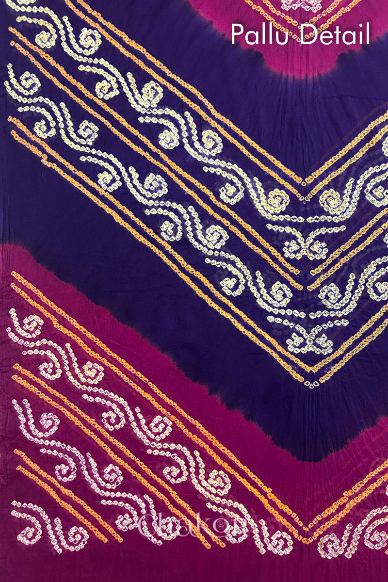 Pallu detail of Purple Magenta Bandhani Mul Cotton Saree featuring multicoloured bandhani patterns.