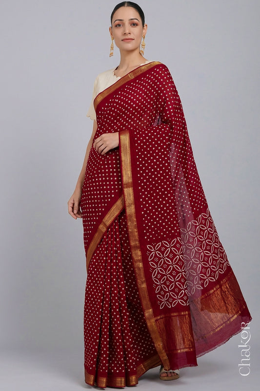 Woman wearing Bright Red Bandhani Mangalagiri Handloom Cotton Saree, with handcrafted rai bandhej patterns using traditional tie-dye techniques.