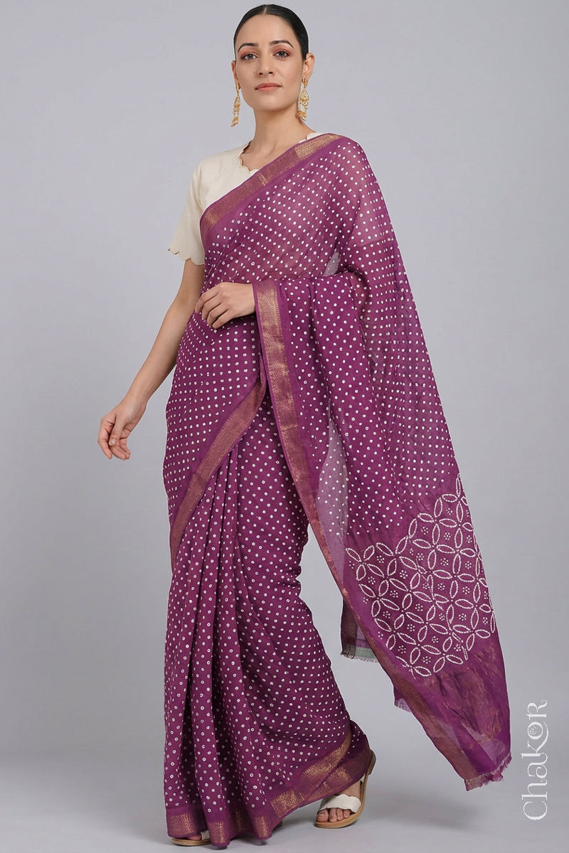 Woman wearing Violet purple Bandhani Mangalagiri Handloom Cotton Saree, with handcrafted rai bandhej patterns using traditional tie-dye techniques.