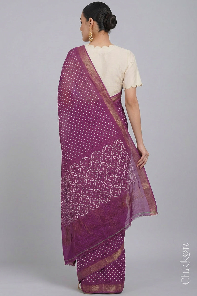 Woman wearing Violet purple Bandhani Mangalagiri Handloom Cotton Saree, with handcrafted rai bandhej patterns using traditional tie-dye techniques.