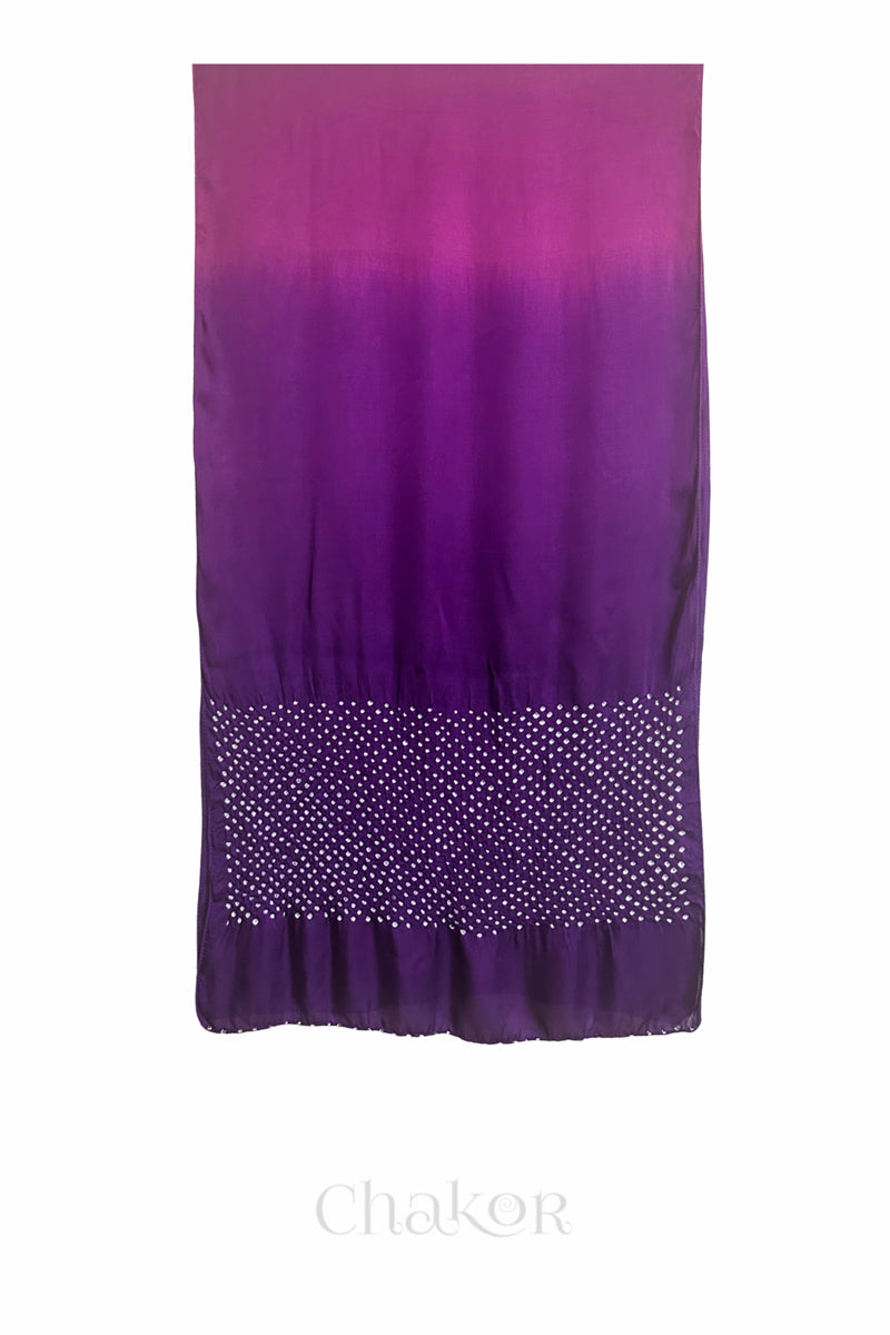 Full view of bandhani stole featuring ombre dyeing in magenta & purple and lustrous texture of modal fabric with 'Chakor' branding.
