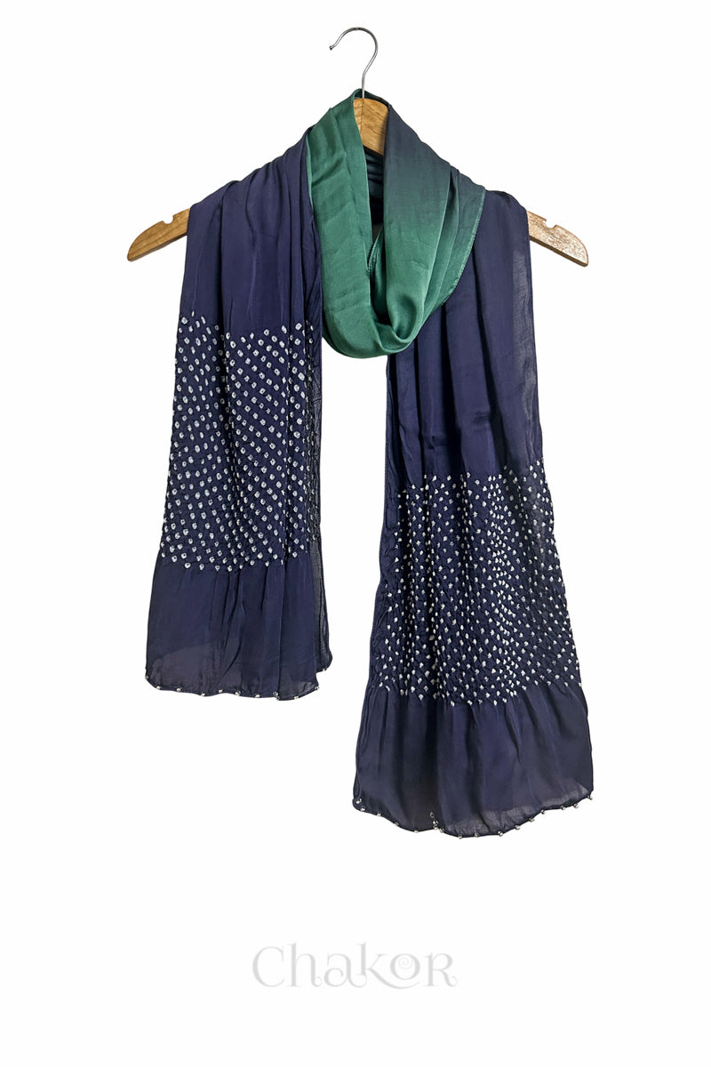 teal & mauve ombre bandhani  scarf with beads detailing on a hanger, brand 'Chakor' visible.
