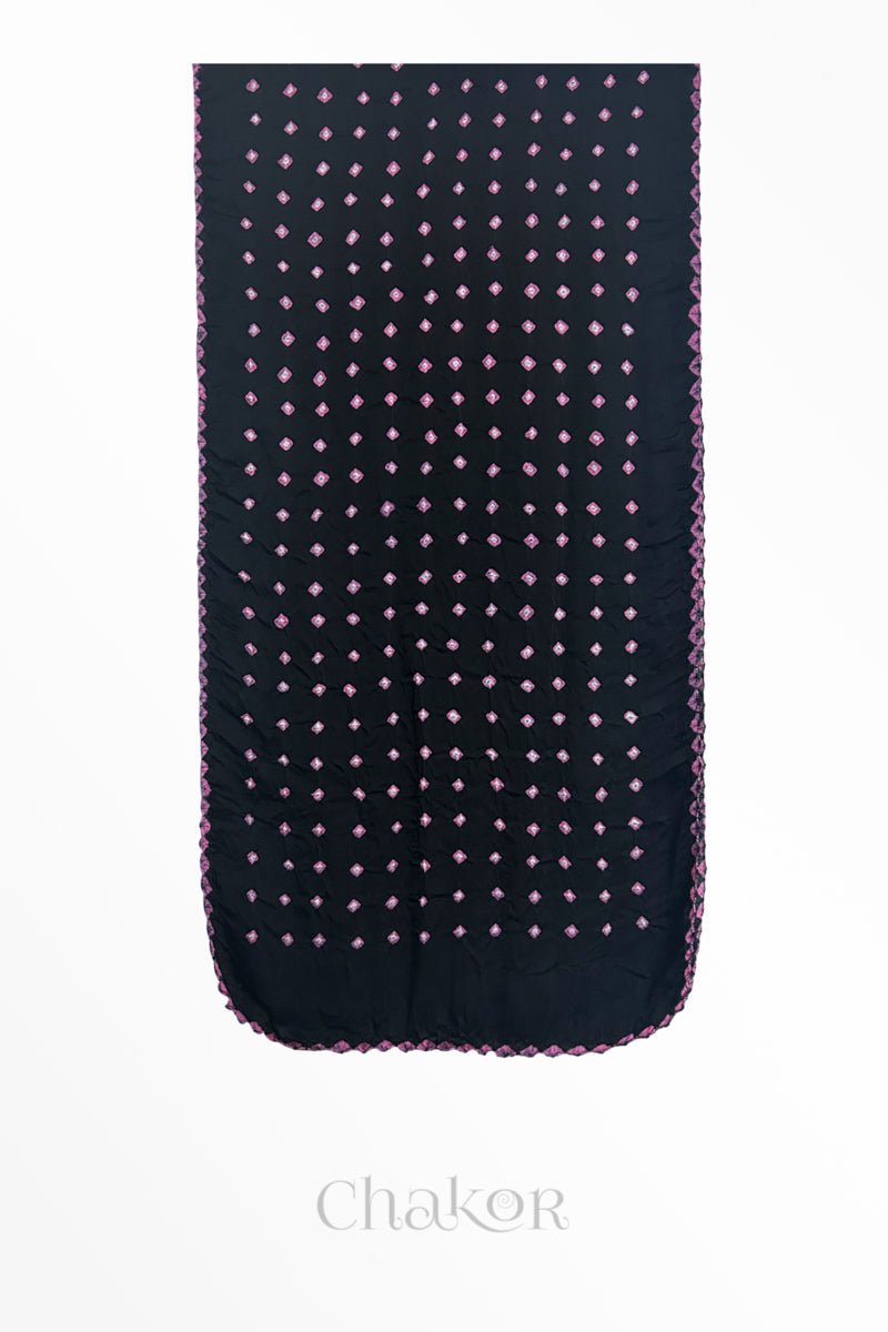 Flat view of black Bandhani modal stole showing evenly spaced tie-dye pattern.
