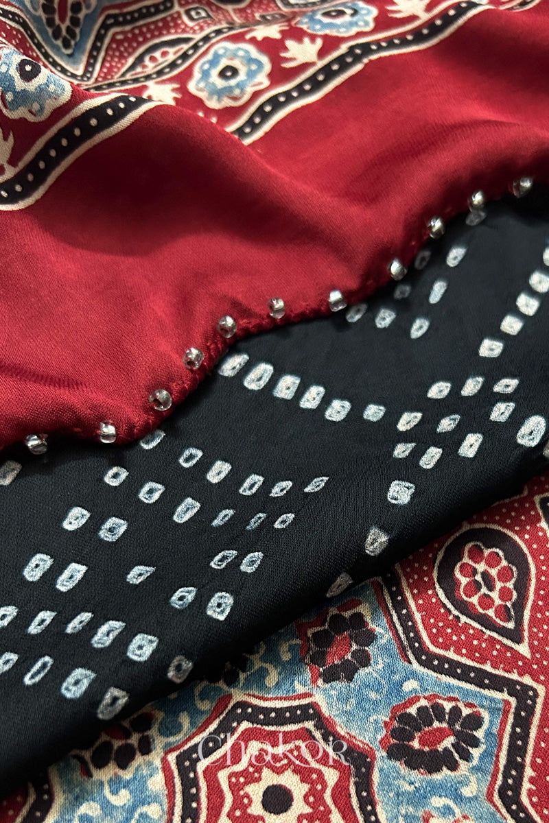 Black Bandhani and Madder Red Ajrakh combination modal stole with glass bead edging detail on pallu end.
