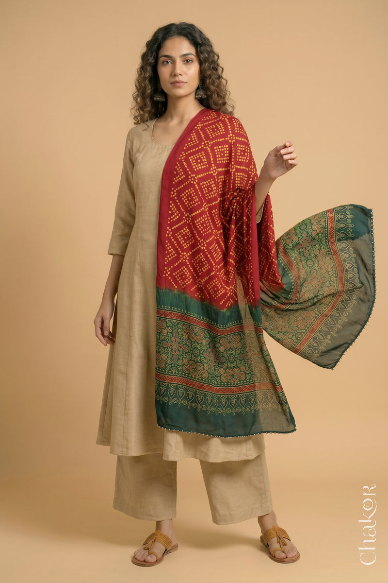 Flowing Red modal Bandhani stole with Green  Ajrakh pallu showing movement and lightweight drape.
