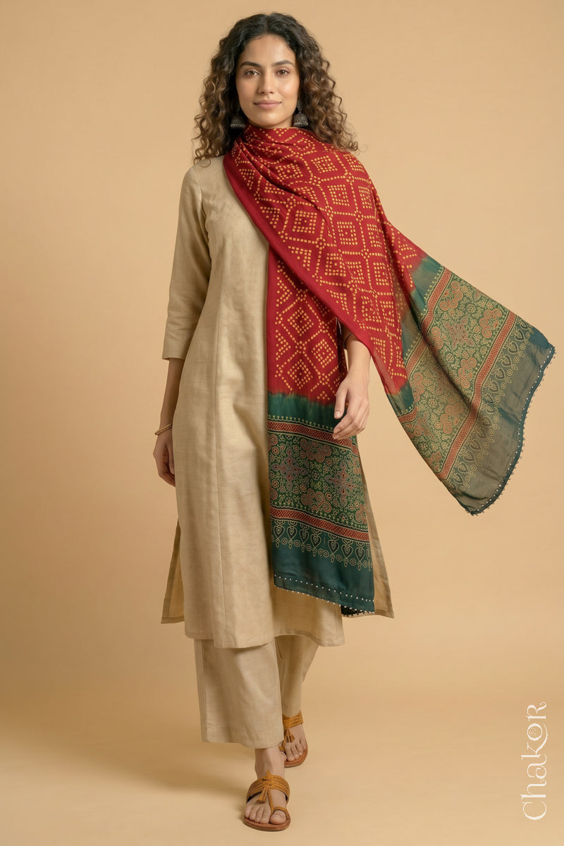 Flowing Red modal Bandhani stole with Green Ajrakh pallu showing movement and lightweight drape.
